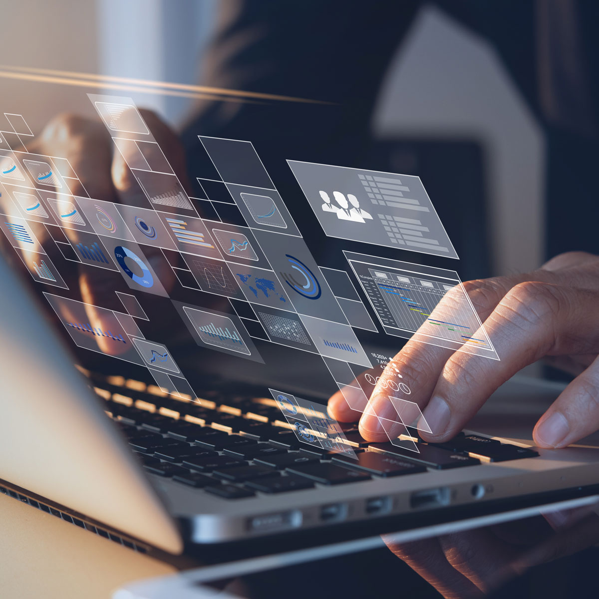 Typing on laptop with digital data overlay, symbolizing software development and data analysis.