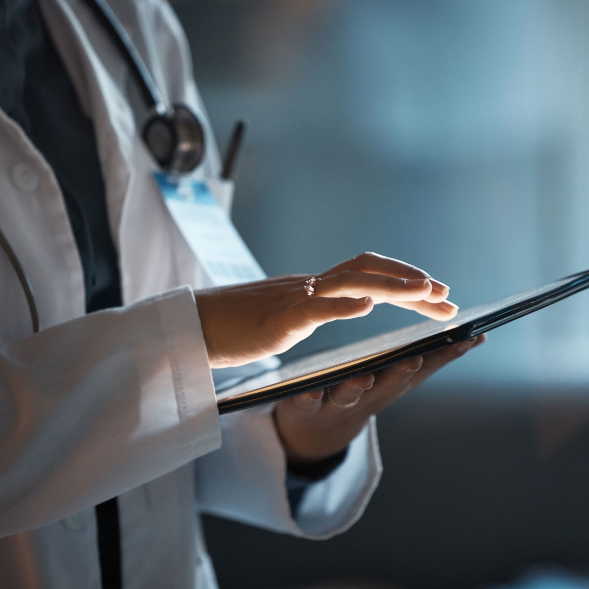 Doctor using a tablet, illustrating AI in healthcare technology.